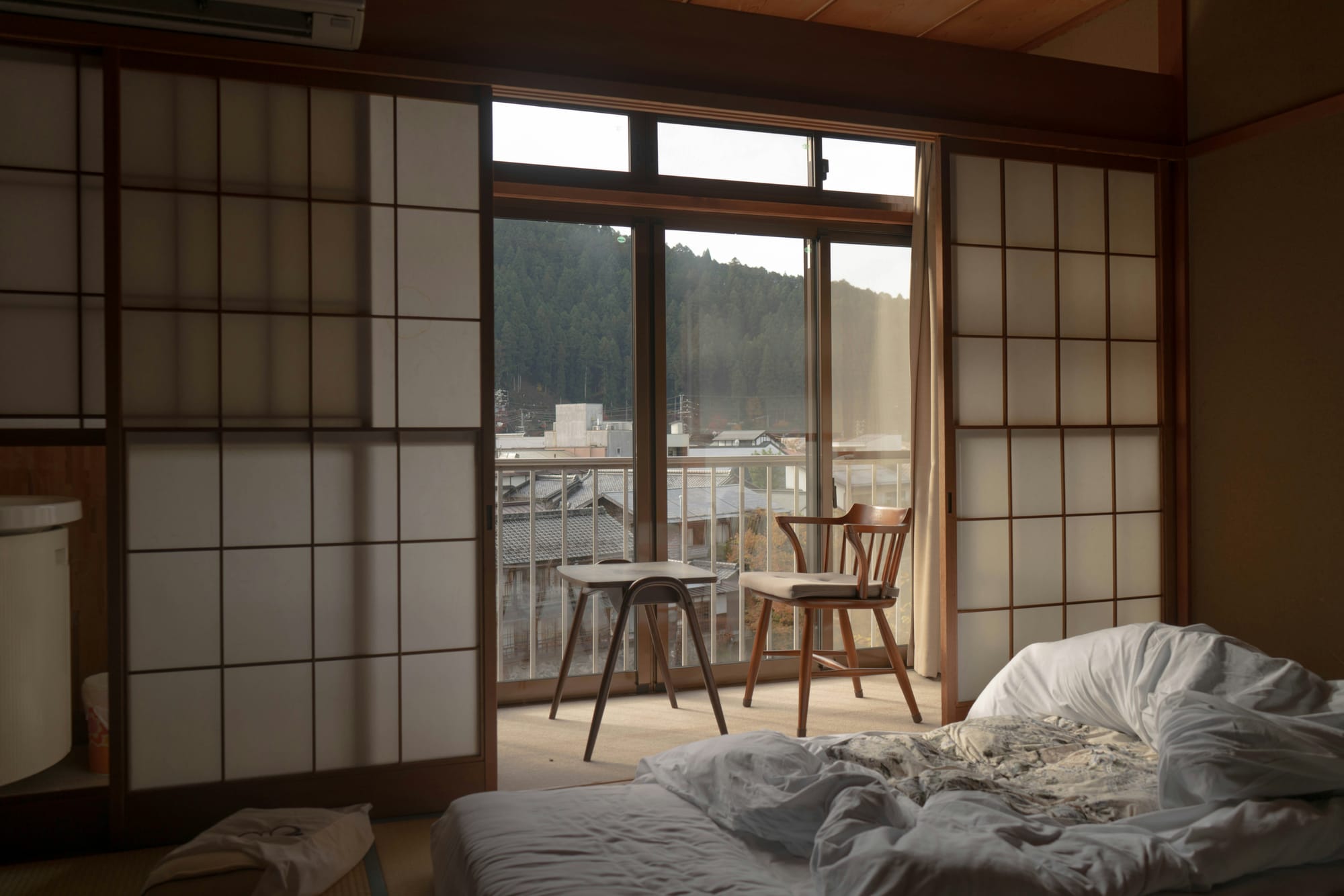Traditional ryokan room with tatami flooring and wooden sliding doors