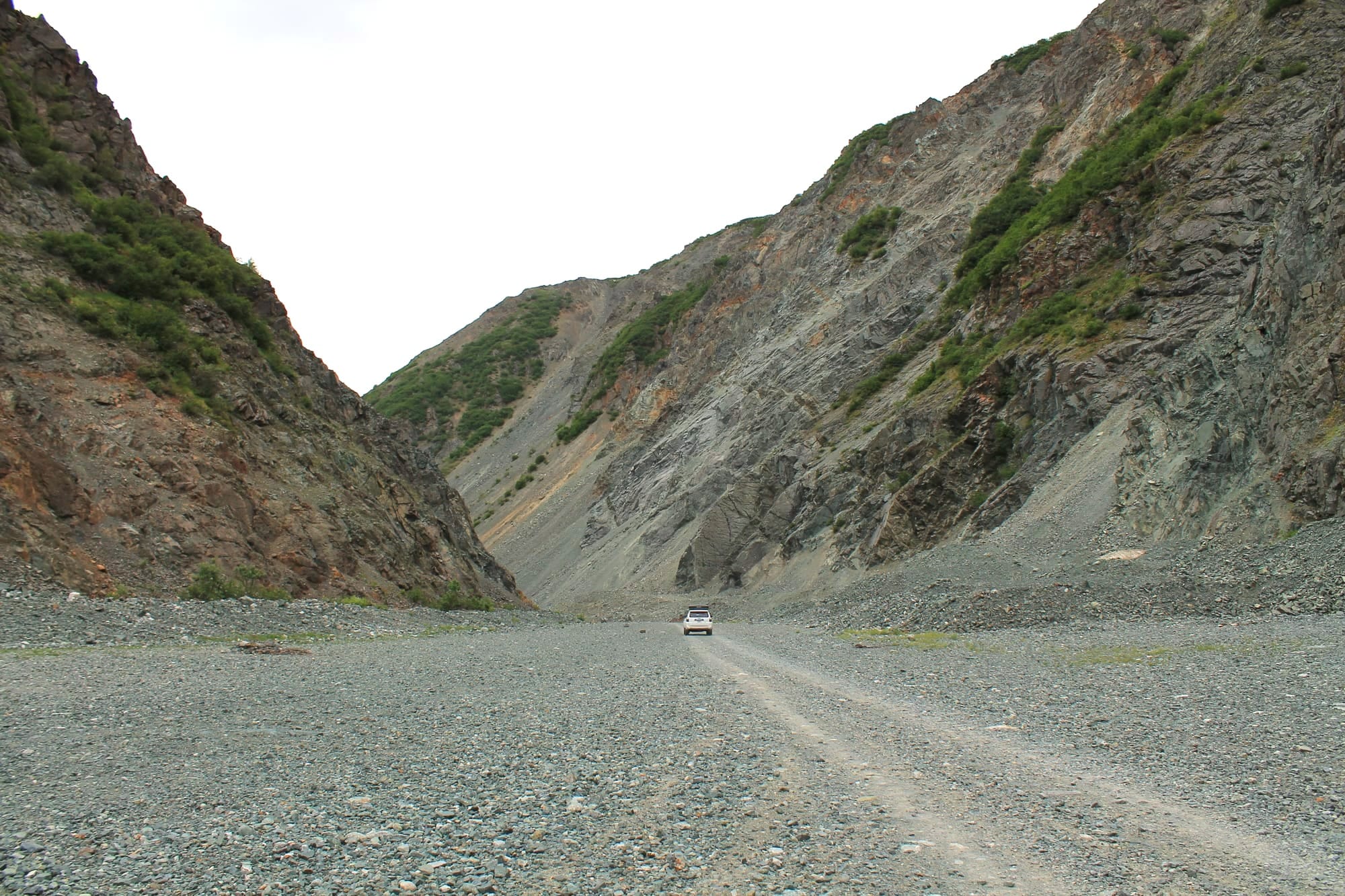 4Runner driving through steep rocky canyon near Red Rock Canyon, Alaska