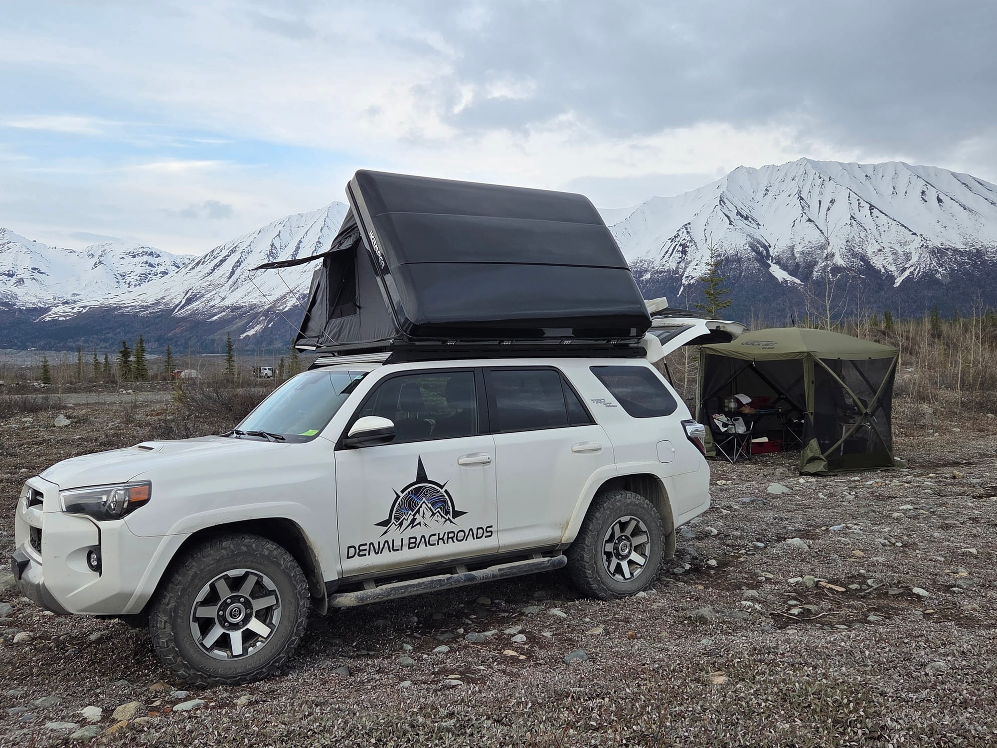 Denali Backroads 4Runner campsite with rooftop tent and mountain views near McCarthy, Alaska.