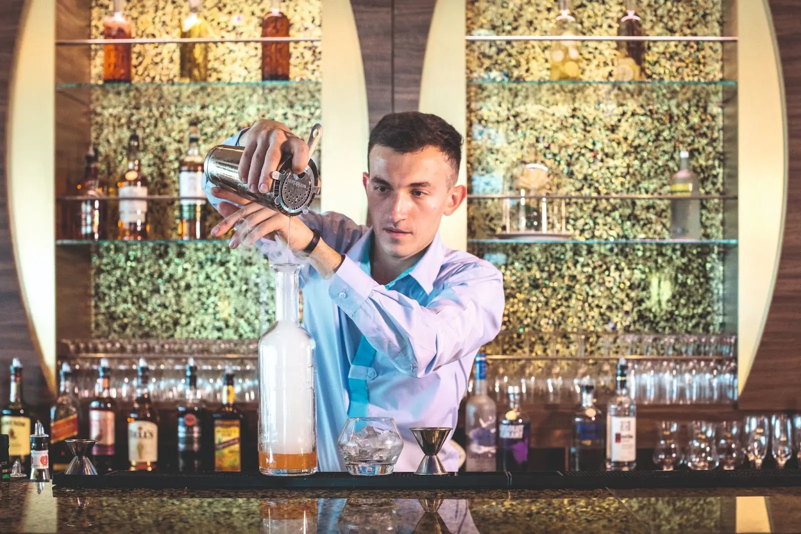 Mixologist crafting a cocktail onboard