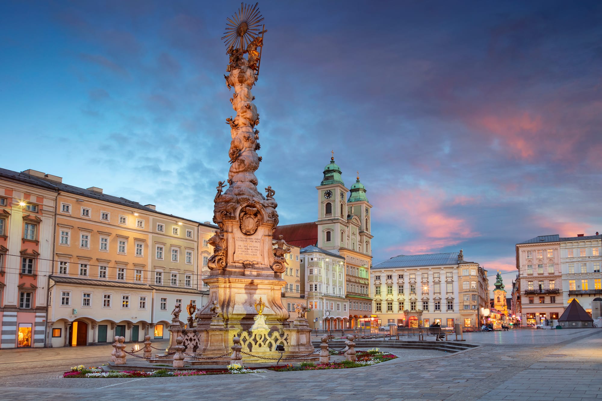 A town square in Linz, Austria at dusk