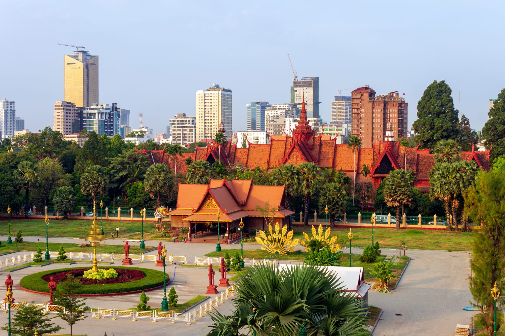 An image of the National Museum of Cambodia in Phnom Penh, a red-roofed building in front of a garden plaza
