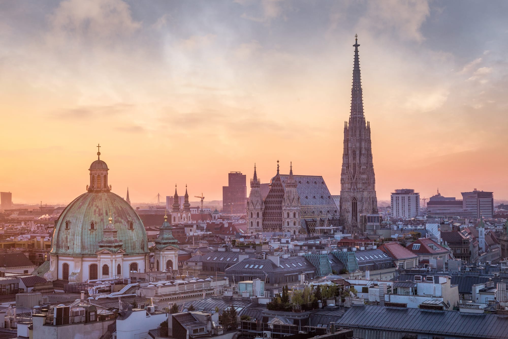 An image of the Vienna skyline with a cathedral spire dominating the other buildings