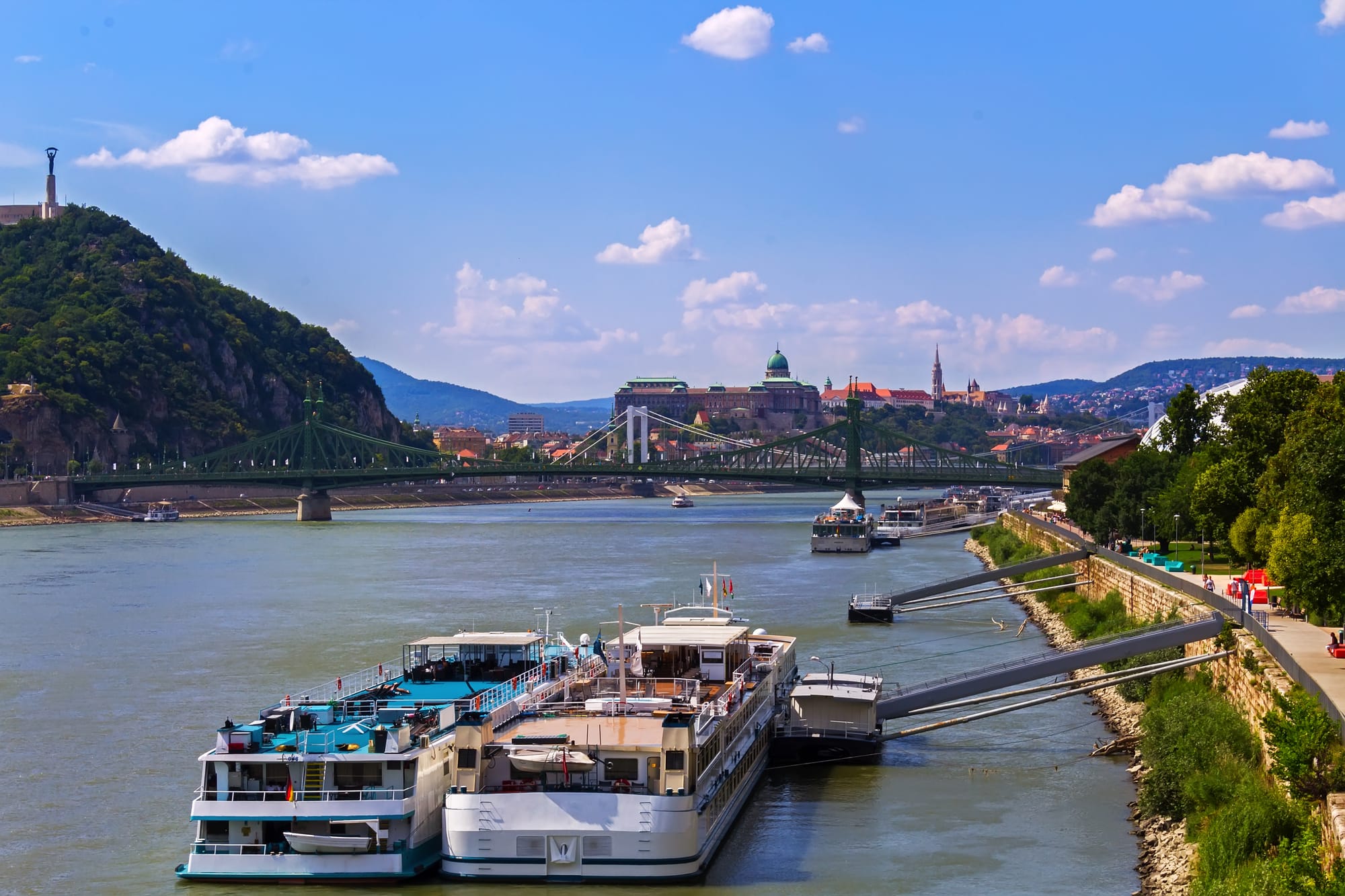 Two river cruise ships on the Danube, docked side by side one another