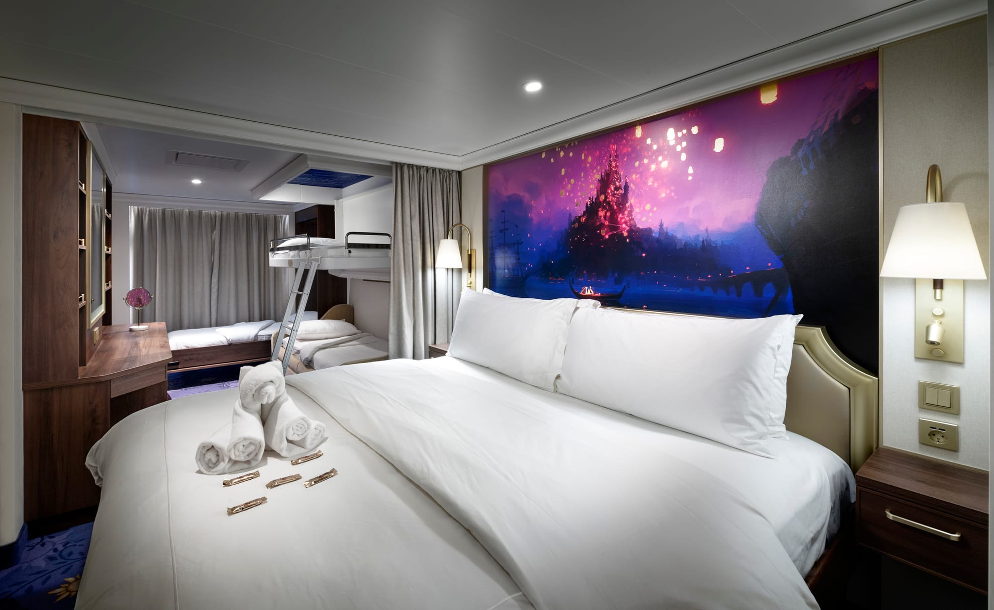 A cabin with a double bed and bunk beds set-up in the living space