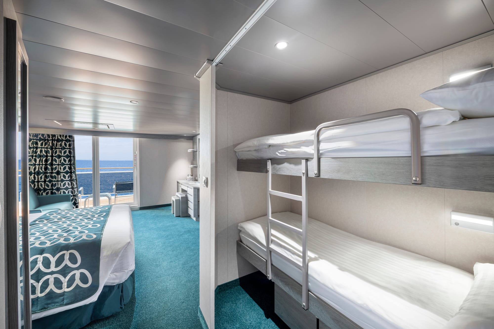A cabin with a bunk-bed and a balcony