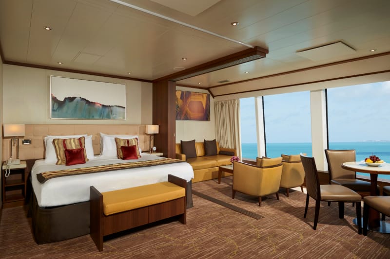 A spacious suite with a double bed and a living room