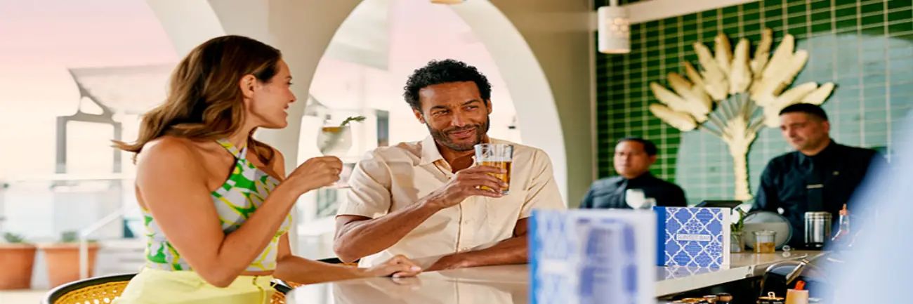 People enjoying a drink in the Sunset Bar on Celebrity Cruises