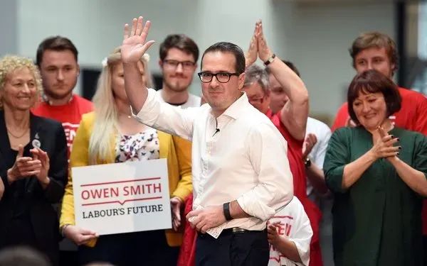 Owen Smith waving.