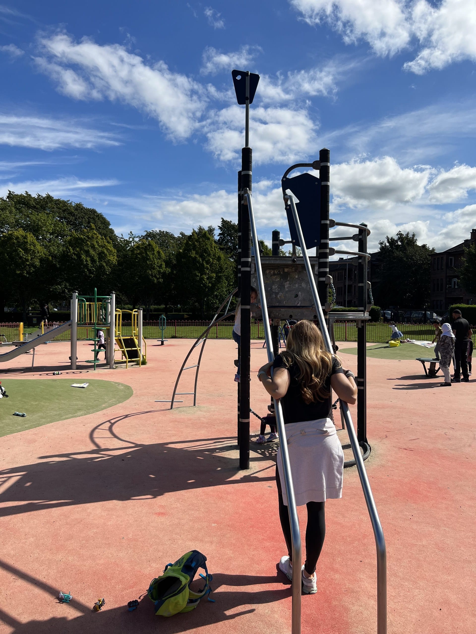 The playground at Holmlea Park in Mount Florida, Glasgow, ringed by stone tenement buildings