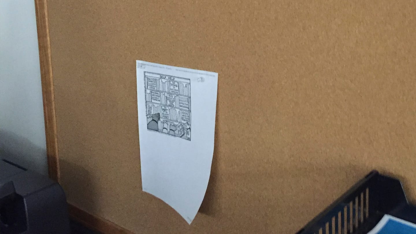 Wide shot of the lone item on the cork board.