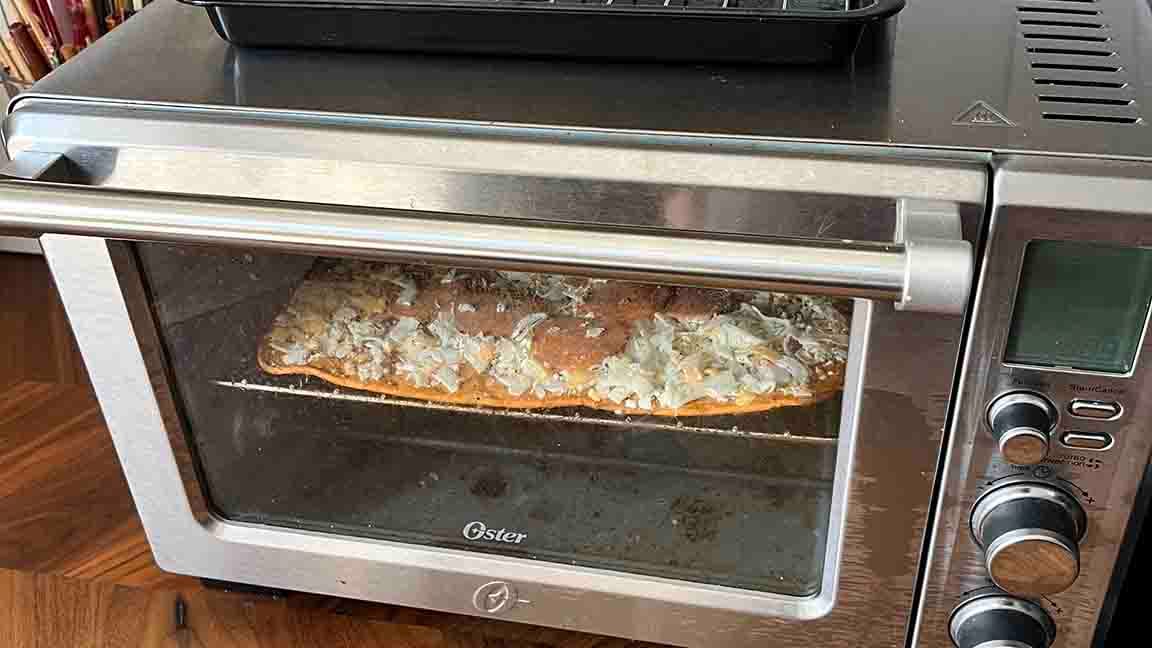 PIZZA IN MY OSTER TOASTER OVEN READY TO GO