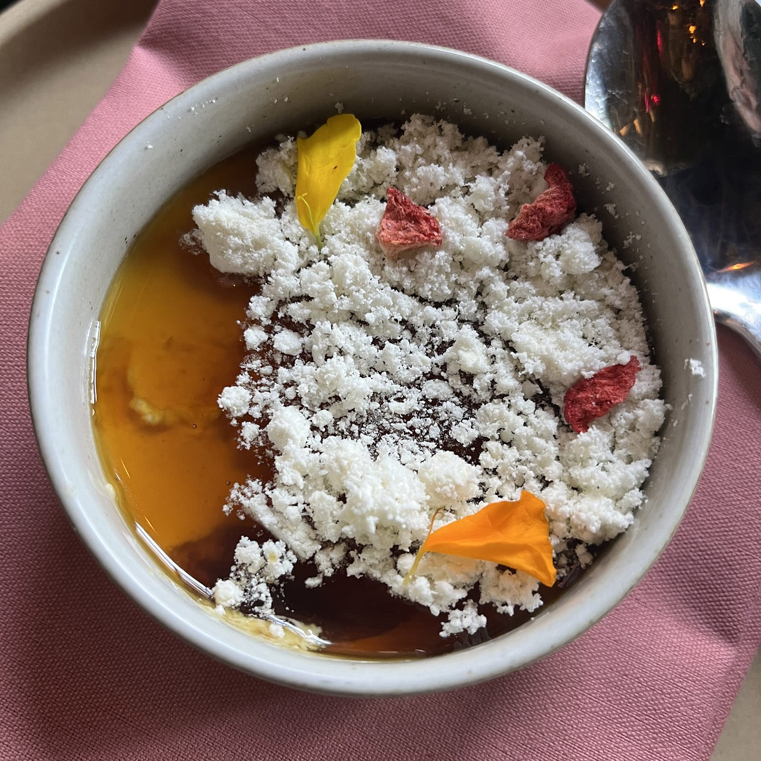 Flan: Mexican custard, caramel piloncillo, extra virgin olive oil soil, and freeze-dried mandarin