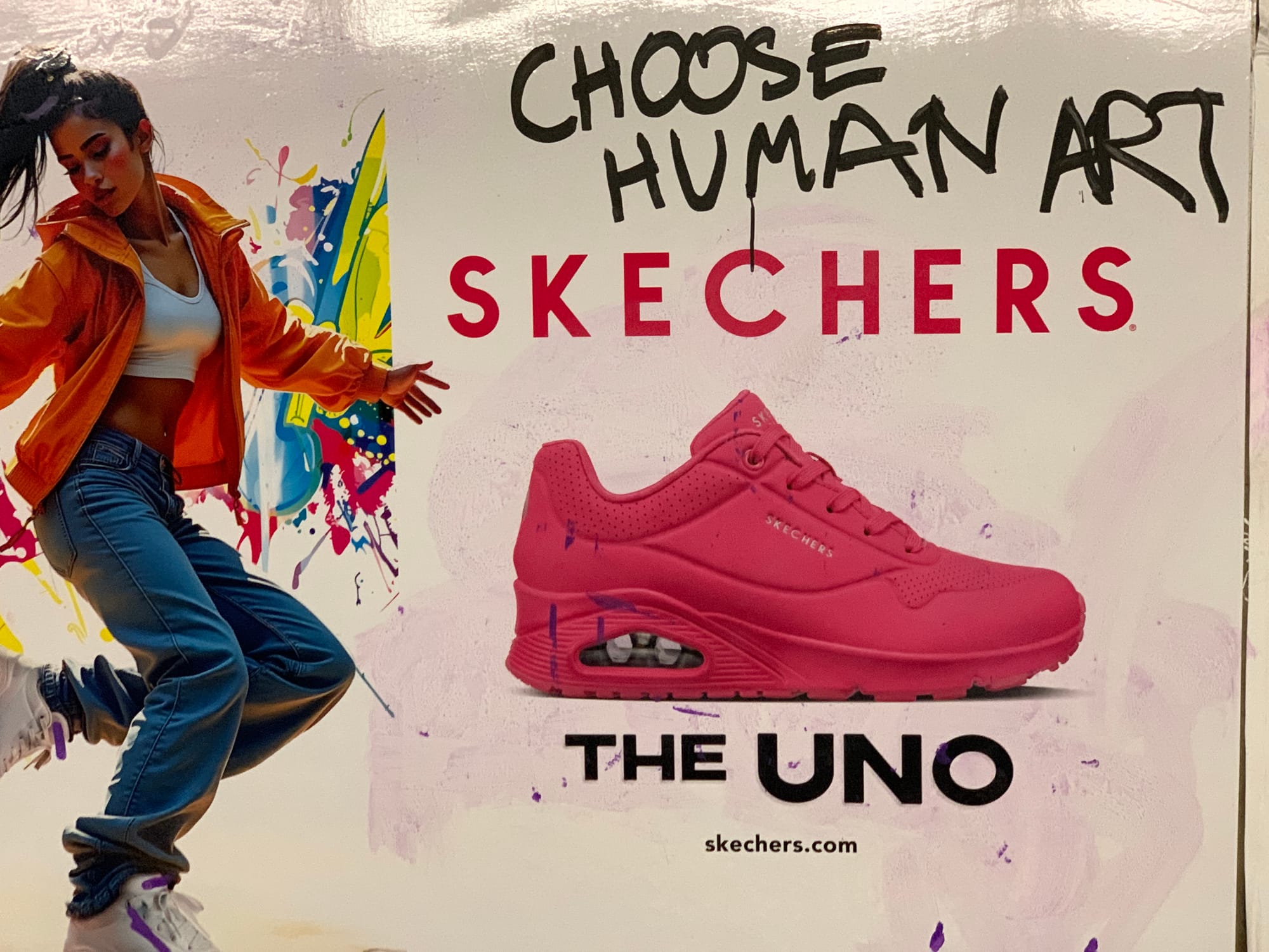 SKECHERS poster with CHOOSE HUMAN ART scrawled over top