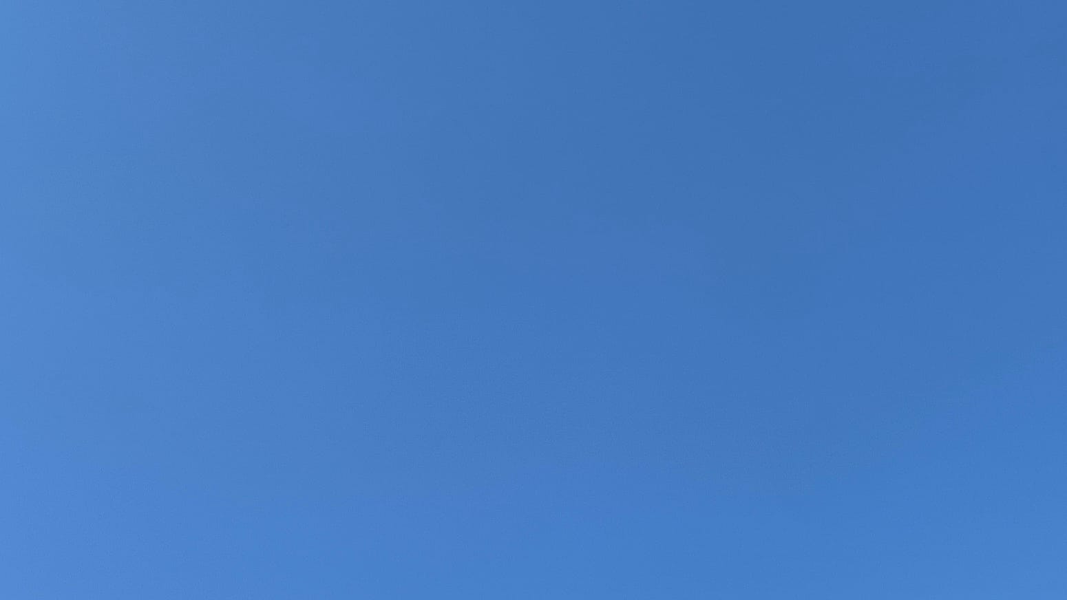 A patch of clean strong blue sky