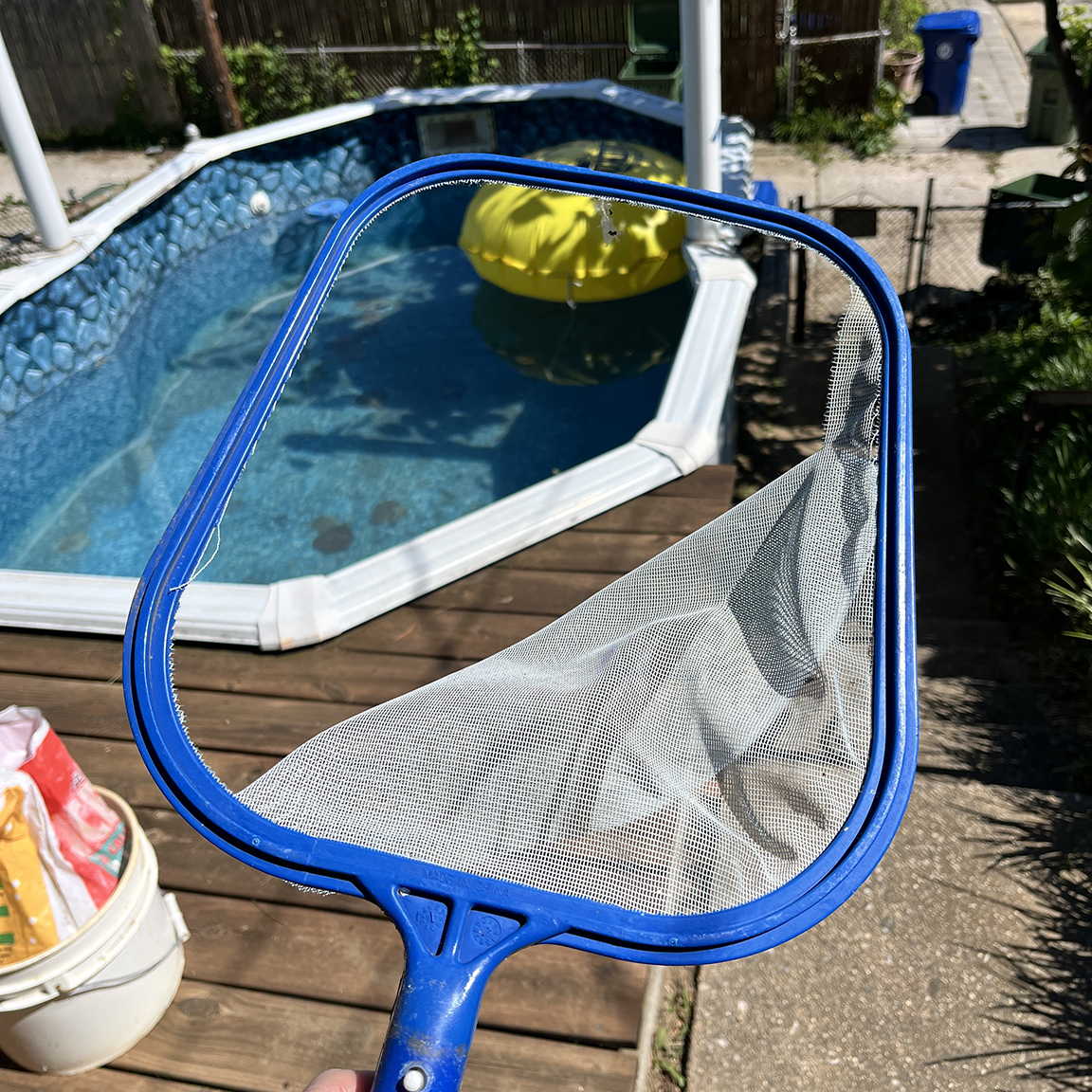 The ripped and worn out mesh of the skimmer. 