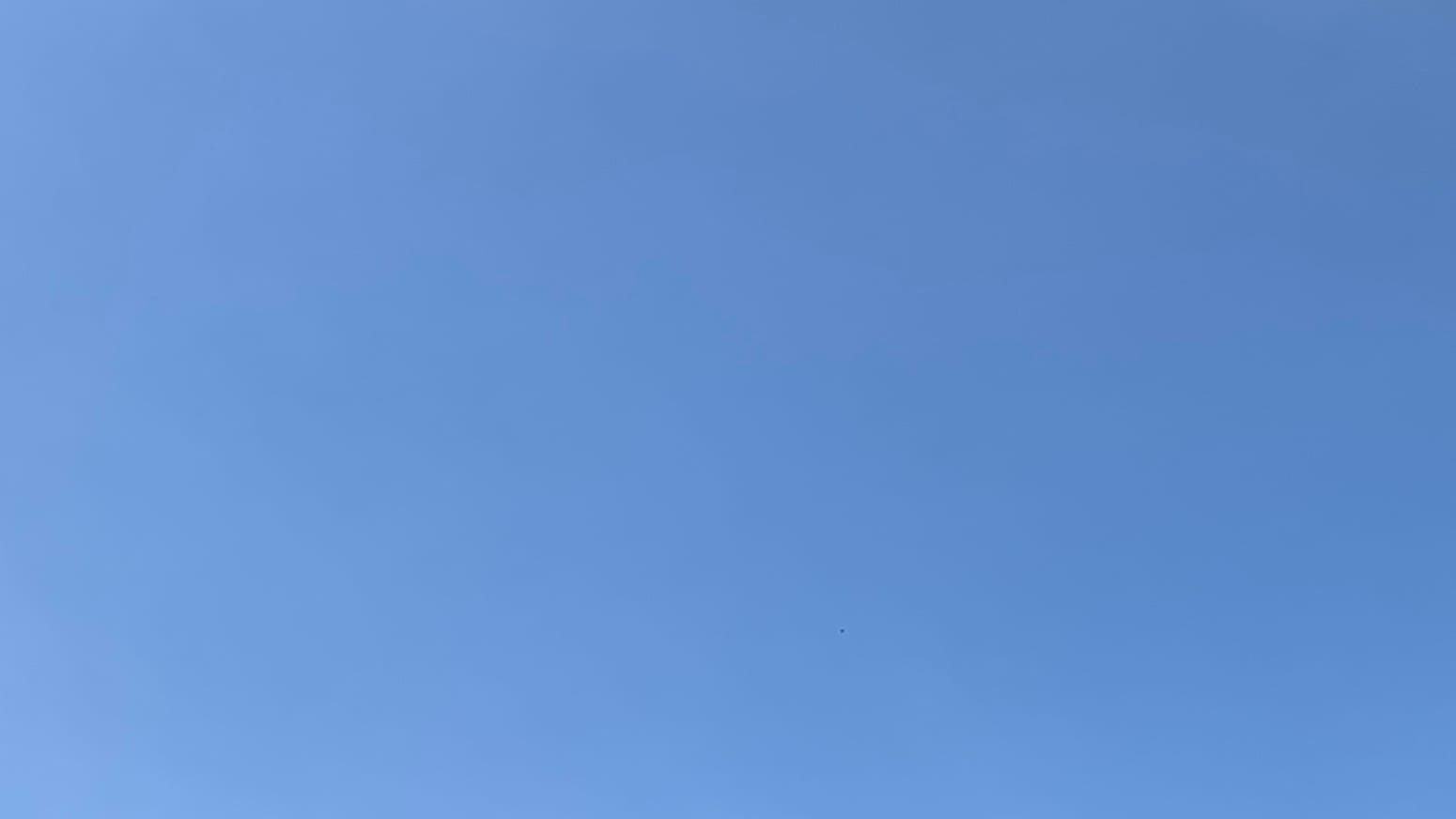 A patch of faintly hazy blue sky