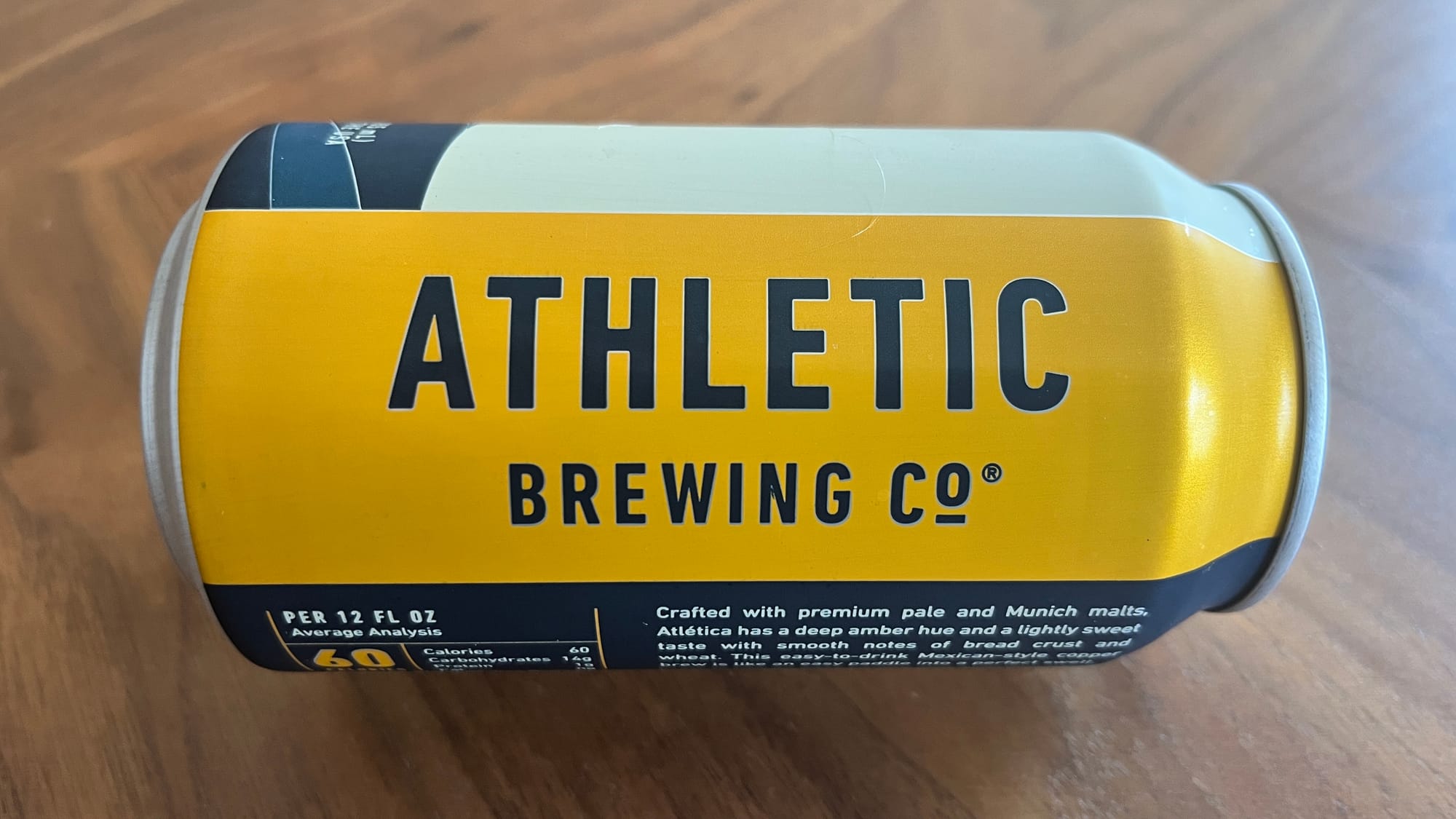 Can of ATHLETIC BREWING CO. beer, "crafted with premium pale and Munich malts," etc.