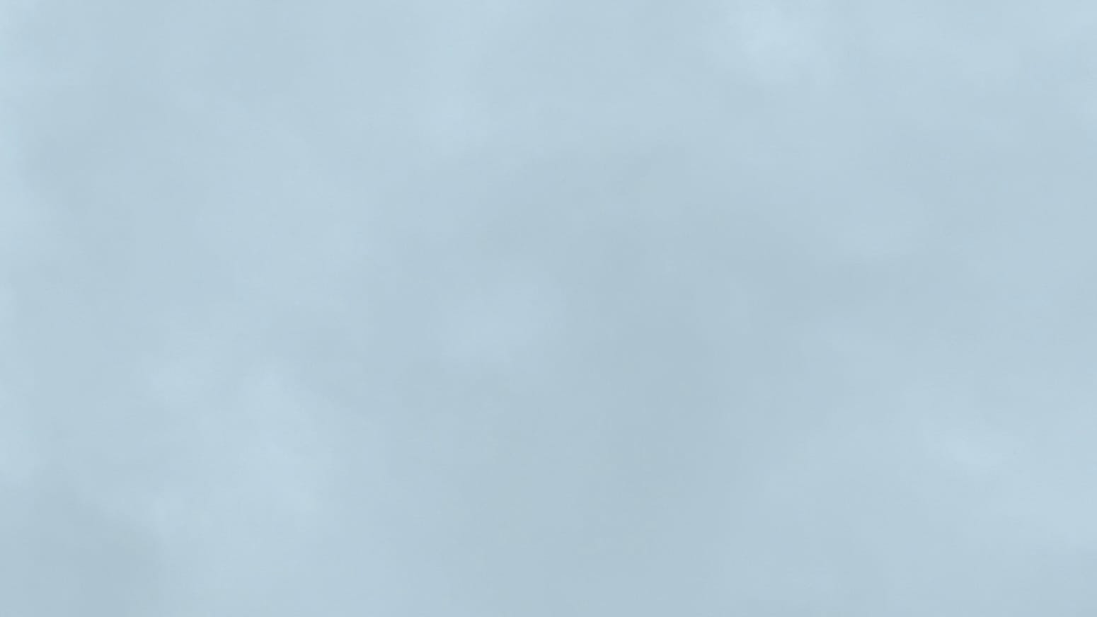 A patch of sky covered in light gray cloud.