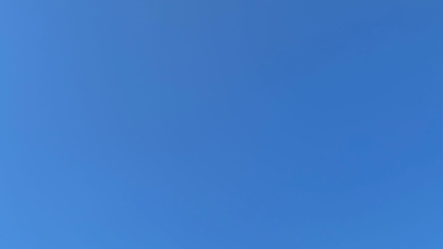 A patch of entirely clear deep blue sky