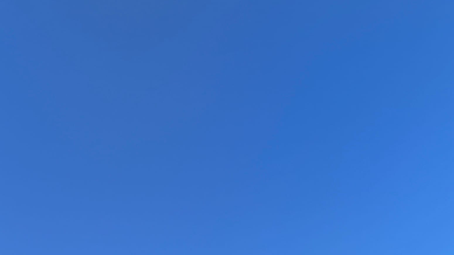 A patch of clear, pure deep blue sky