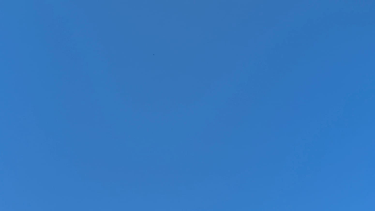 A patch of clear, extra-deep blue sky