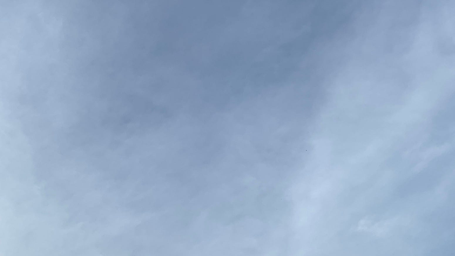 A lightly cloudy blue sky