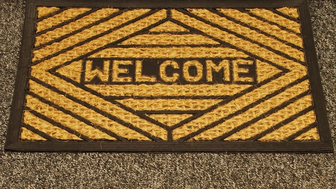 A photo of a WELCOME mat