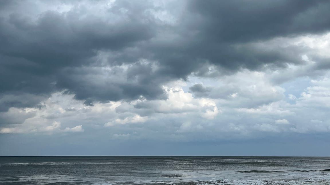 The beach: Ocean and kinda gloomy clouds