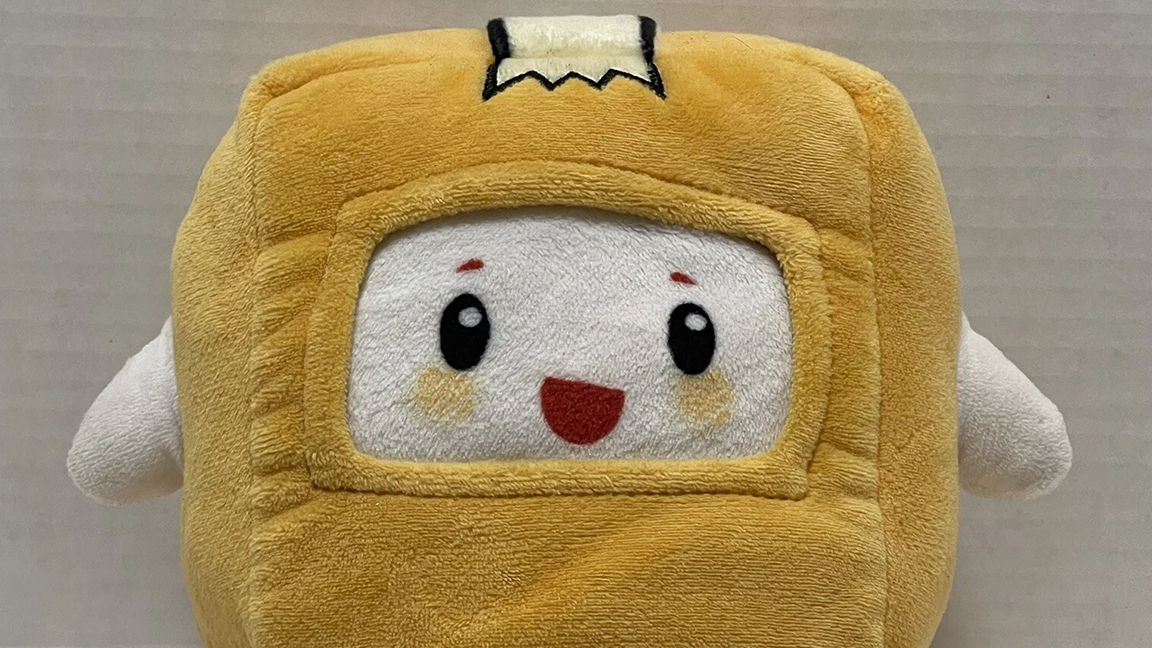 A plump yellow box with a smiling face inside and a ribbon running down the top flanked by with little flipper-arms