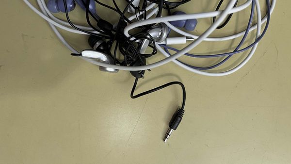 A tangle of old-school cables with an trusty old audio jack sticking out