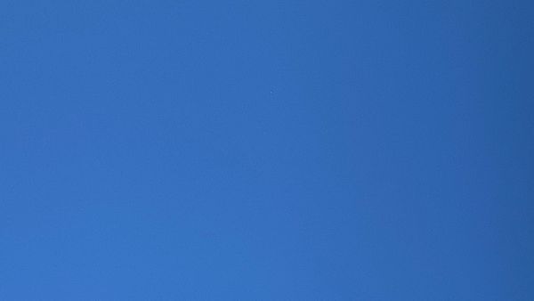 A patch of perfectly featureless deep blue sky