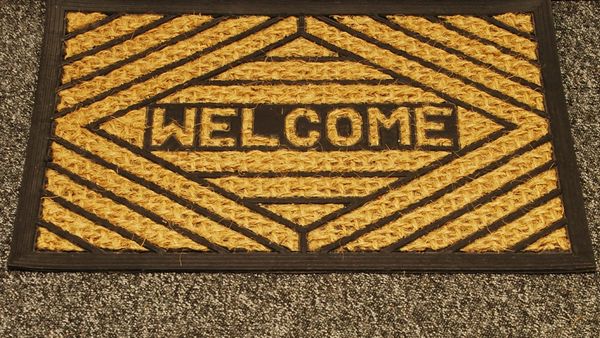 A photo of a WELCOME mat