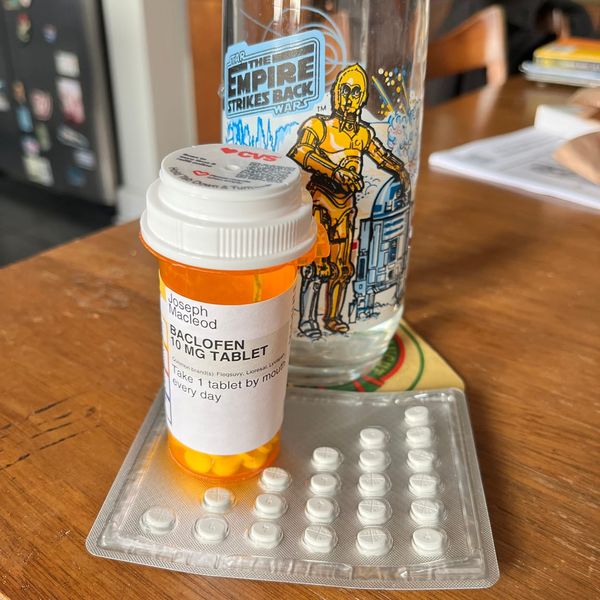All my pills, my BACLOFEN, my MethylPREDNISolone, and my Burger King STAR WARS glass with the robots on it