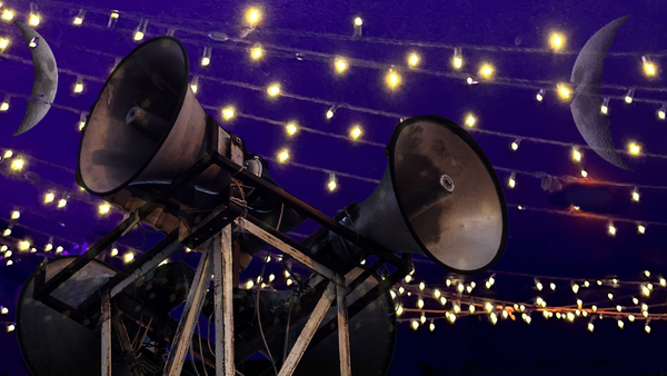 PA loudspeakers surrounded by lights. Two moons in the night sky.