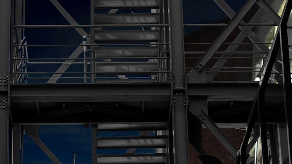 Metal stairs against night sky