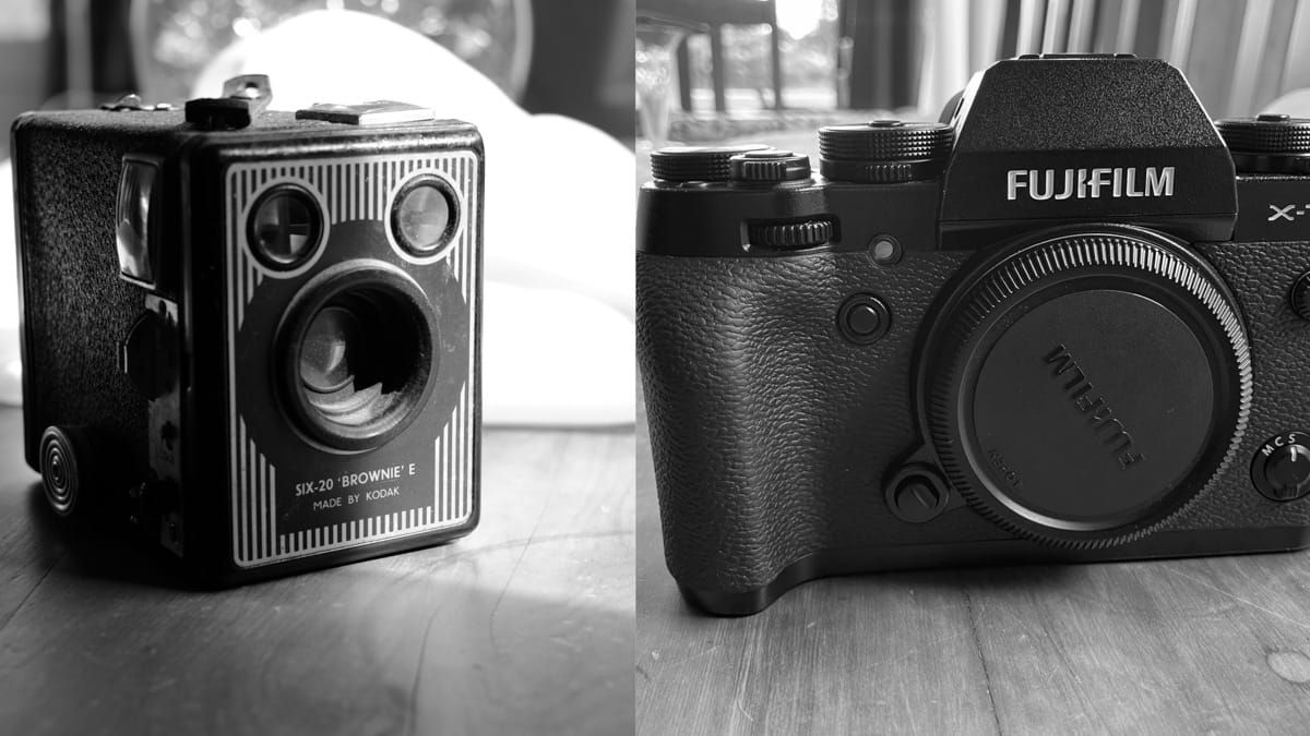 Film camera and a digital camera side by side.