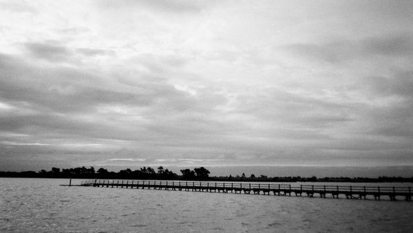 Black and white image of a pier.