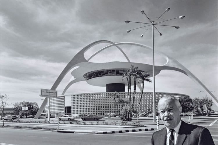 Paul R. Williams standing in front of the LAX Theme Building