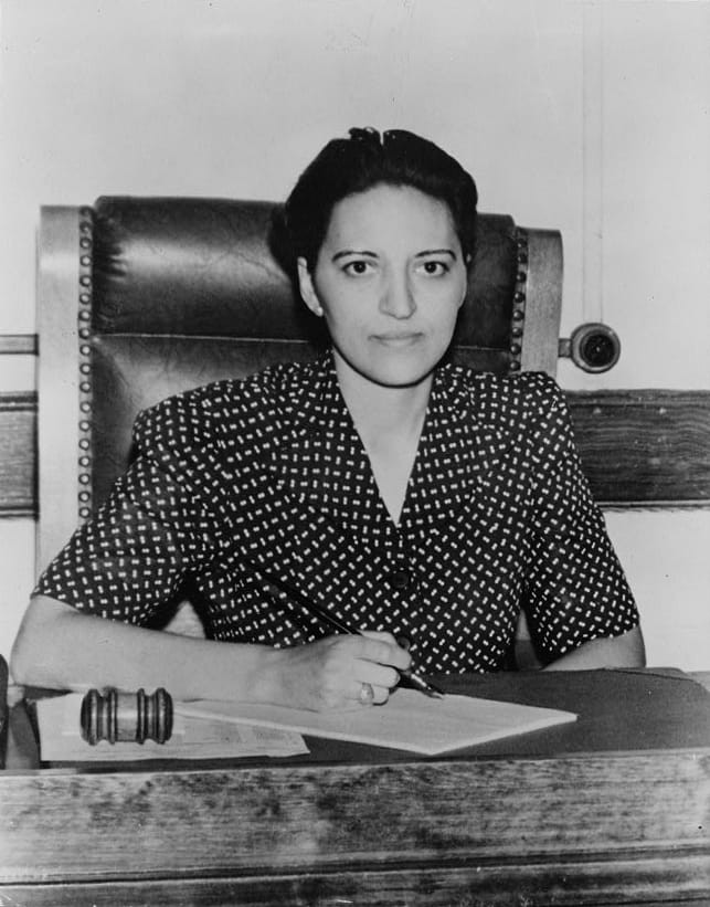 Jane Bolin in court with a gavel by her side. 1942.