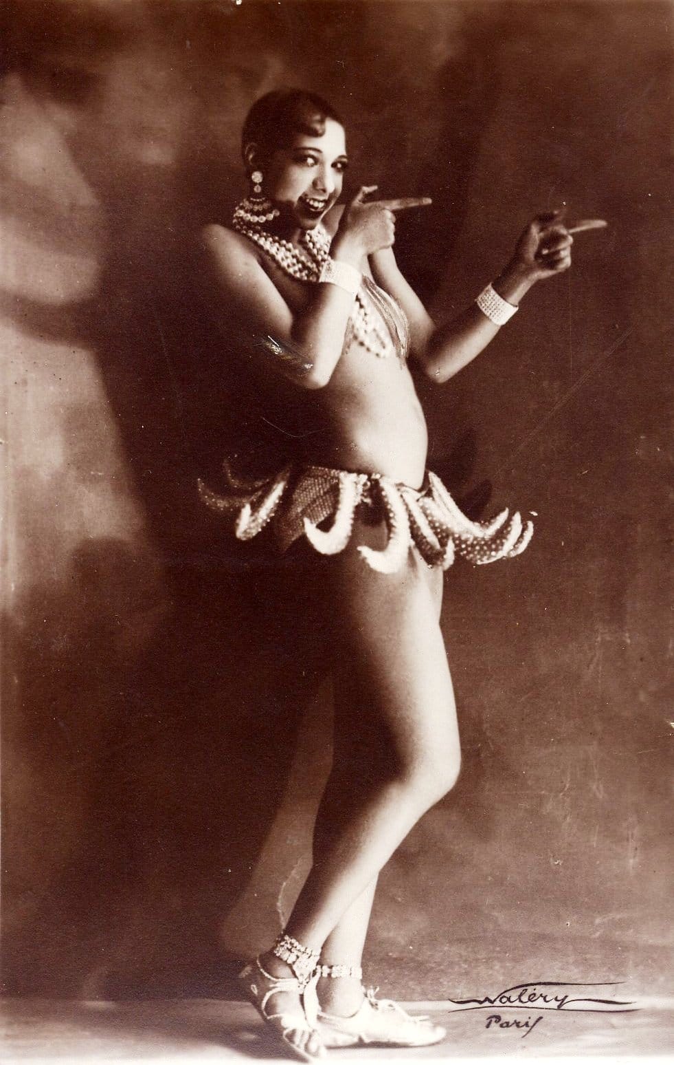 a black and white photo of josephine baker posing in costume