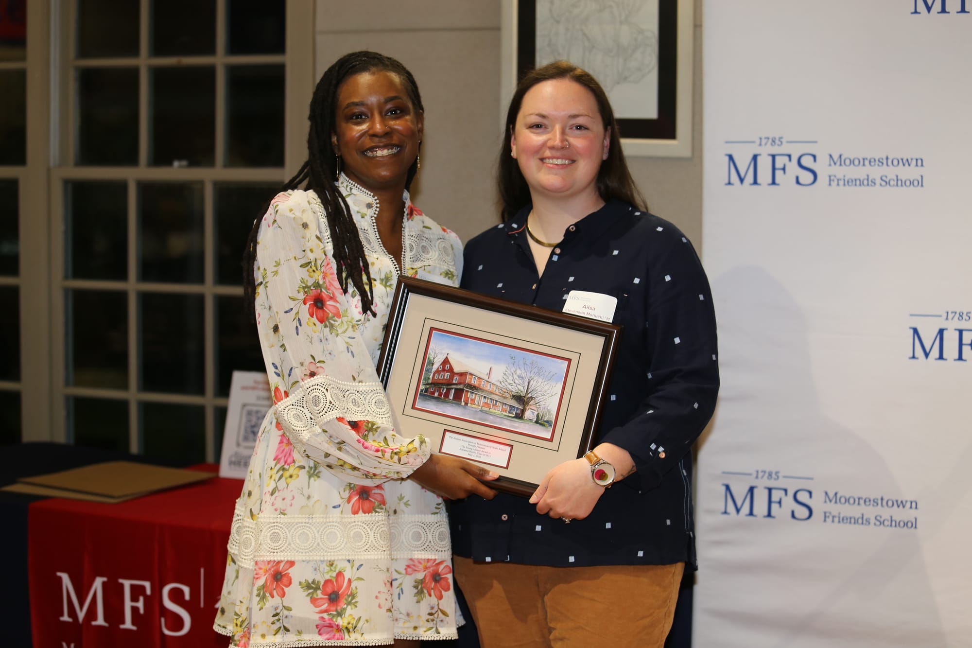 Ailsa Moriuchi presents Alleanna Harris with the Moorestown Friends School Young Alumni Award. Photo courtesy of MFS.