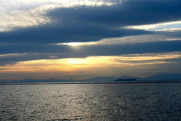 Clouds and setting sun over Lake Champlain