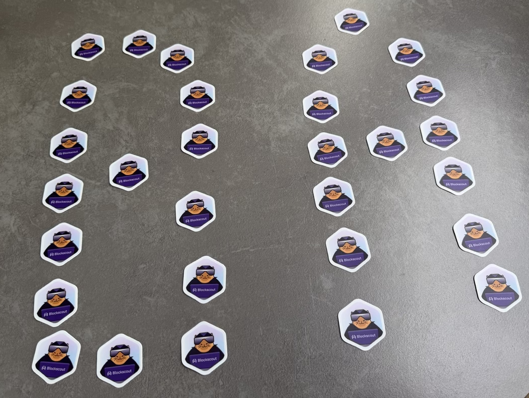 Blockscout branded hexagon stickers featuring blockchain explorer mascot for conference swag and promotional merchandise at Devconnect Buenos Aires