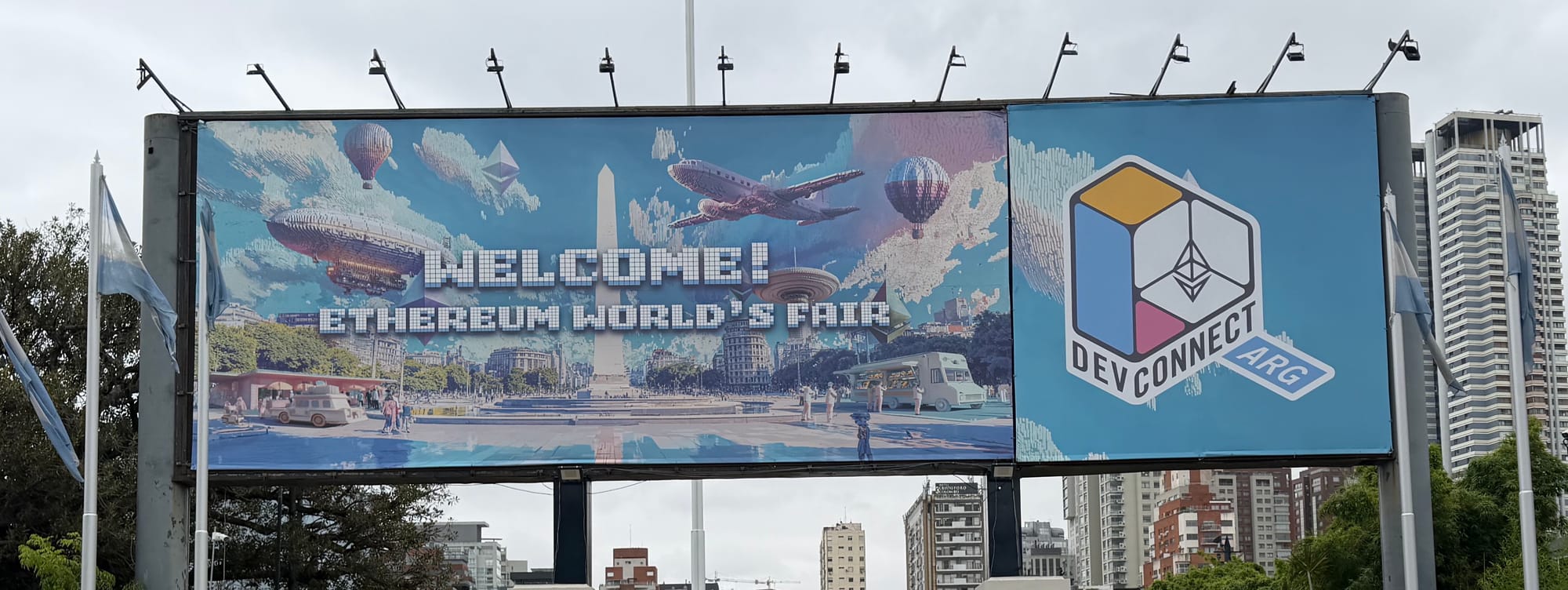 Devconnect Ethereum World's Fair welcome billboard in Buenos Aires featuring Ethereum logo and pixel art cityscape at blockchain conference 2025