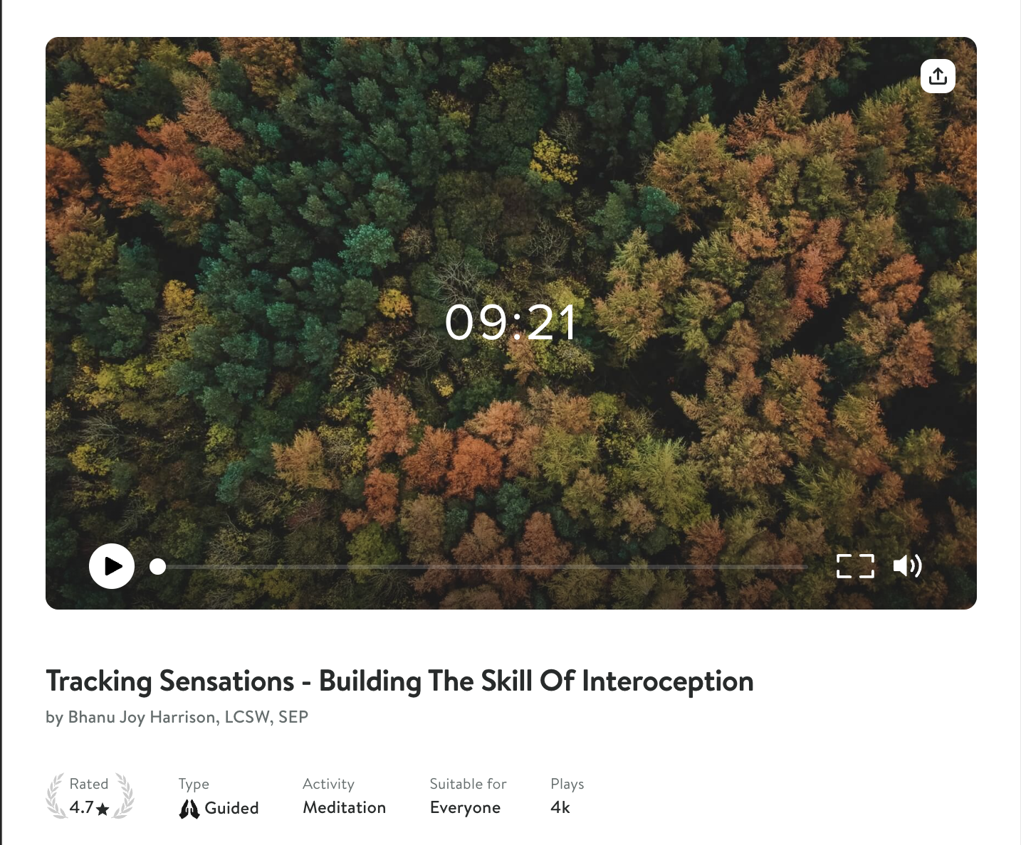 Screenshot from Insight Timer over an aerial view of a forest changing color in fall.