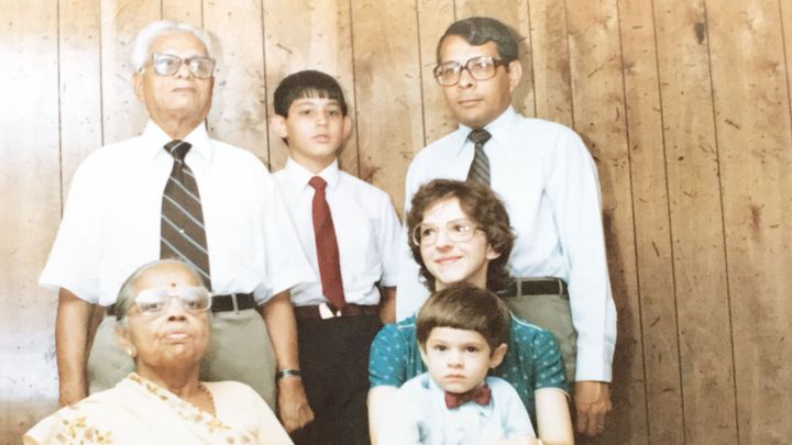 A family photo: two grandparents, two parents, and their two boys.