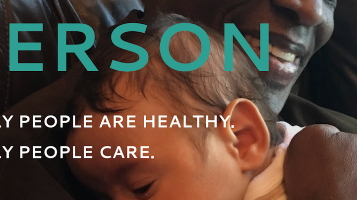 A cropped image of a slide showing a photo of a happy grandfather caressing his sleeping baby