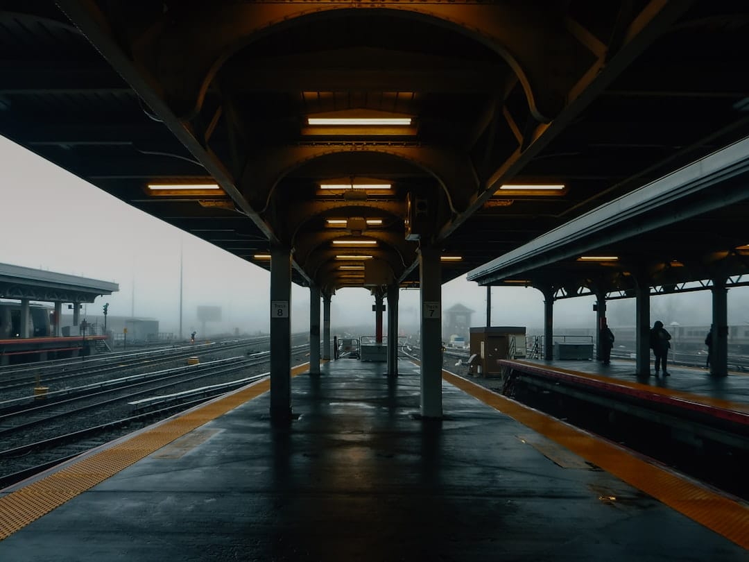 Empty train station platform on a foggy day