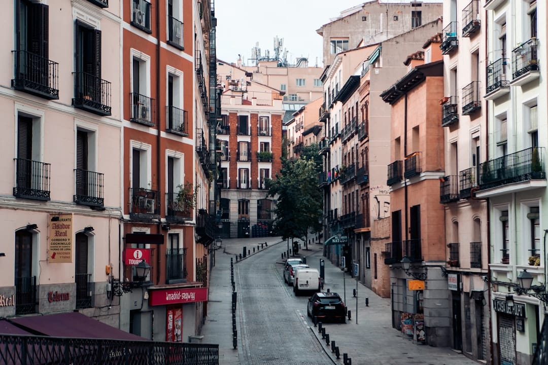 A narrow city street lined with tall buildings